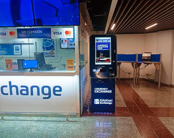 Globo Cambio currency exchange dispenser at an airport. Globo Cambio currency exchange dispenser at an airport.